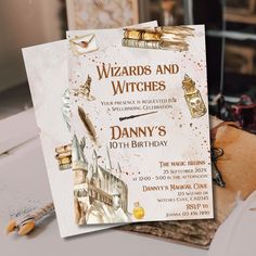 a wizard's and witches birthday party card on a table