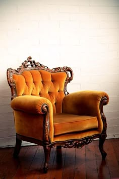 an old fashioned chair sitting on top of a hard wood floor