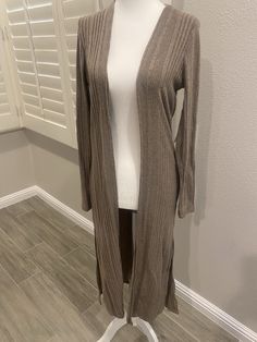 Casual long sleeve cardigan. 97% rayon 3% spandex Chic Long Cardigan For Loungewear, Chic Long Loungewear Cardigan, Trendy Fitted V-neck Sweater Coat, Chic Long Soft Knit Cardigan, Knit Long Sleeve Outerwear For Layering, Fitted Knit Cardigan For Layering, Chic Long Sweater For Fall, Trendy Long Brown Cardigan, One Size Long Sleeve Sweater For Layering