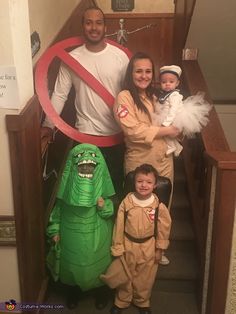 a family dressed up in costumes for halloween