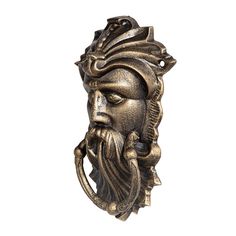 an old bronze door handle with a man's head and beard on the front