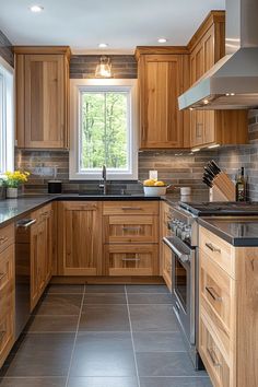 a kitchen with wooden cabinets and black counter tops is pictured in this image from the front view