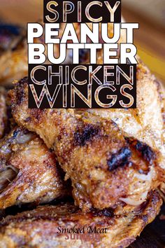 chicken wings on a plate with the words spicy peanut butter chickens written in white letters