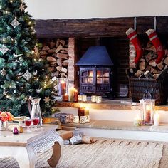 a living room with a christmas tree and fireplace