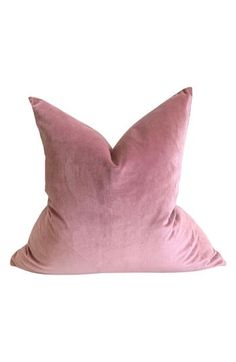 a pink pillow on a white background