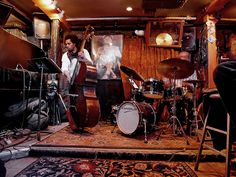 a group of people playing instruments in a room