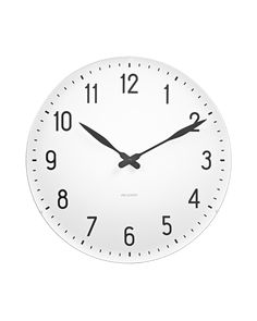 a white clock with black hands and numbers on the face is shown against a white background