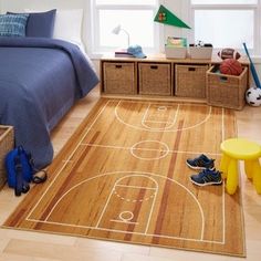 a child's bedroom with a basketball court rug on the floor and toy bins