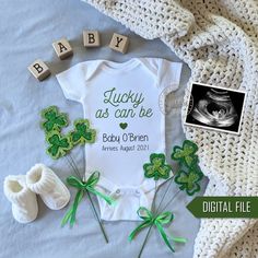 baby announcement with st patrick's day decorations and photos