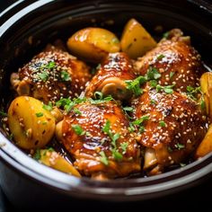 the meat is covered in sesame seeds and garnished with green onions