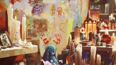 a room filled with lots of different types of art and crafts on the walls,