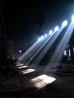 the sun shines brightly through windows in an industrial building