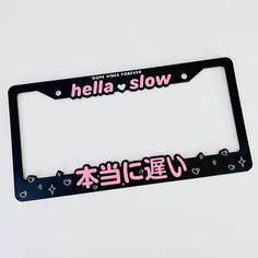 a license plate frame with the words hello love written in pink and black letters on it