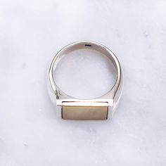 MIXED METAL FLAT TOP RING | 925 STERLING SILVER & BRASS– Jewelry Lab  Smooth silver band with chic flat top brass centerpiece embedded. Available in silver and brass rings with mixed metal centerpieces. Metal Centerpieces, Flat Top Ring, Gold Pinky Ring, Mens Pinky Ring, Unique Mens Rings, Mixed Metal Rings, Brass Rings, Chic Flats, Top Rings