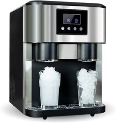 an espresso machine with two cups on the side and ice in front of it