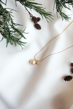 This stunning miniature Christmas baubles necklace is made of stainless steel and is 14k gold plated, lead and nickel free. It makes a fantastic Christmas gift for you or your loved ones. Chain length: 40cm + 5cm extender chain All of our jewellery comes beautifully packaged in our branded gift box. Your jewellery will last longer if you correctly care for your item. Care instructions: Always remember to remove your jewellery before shower or exercise. Please avoid contact with perfumes, body oils, and other chemicals, including household cleaners. For cleaning, gently polish with a soft, lint-free cloth to avoid scratching. Please store it in a cool dry place. If you have any questions do not hesitate to contact me, I will be more than happy to answer! Follow @donlonco on Instagram to see Gold Necklace For Christmas Celebration, Gold Pendant Jewelry For Christmas, Gold Jewelry For Festive Holiday Occasions, Gold Necklaces For Christmas Celebration, Gold Necklace For Holiday Gift, Gold Necklace Holiday Gift, Holiday Gold Necklace Gift, Christmas Celebration Yellow Gold Jewelry, Gold Necklace For Festive Christmas Occasion