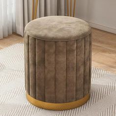 a large round ottoman sitting on top of a rug