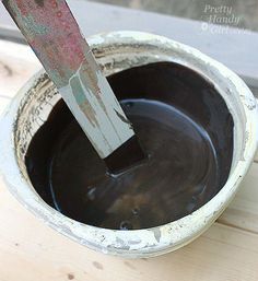 a person using a spatula to dip melted chocolate