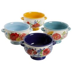 four bowls with different designs on them