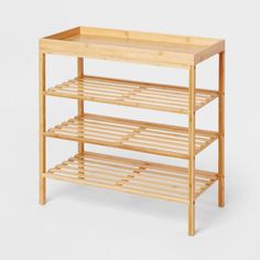 a wooden shelf with two shelves on each side