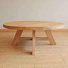 a wooden table sitting on top of a hard wood floor