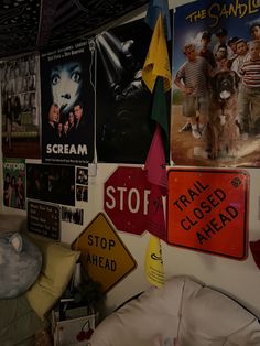 a room with posters and signs on the wall, including children's movie posters