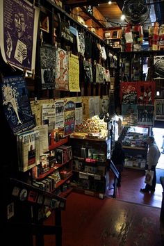 there are many books on the shelves in this store that is filled with various items