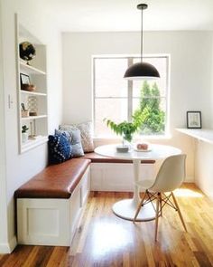 an instagram photo of a small kitchen table and bench with built - in seating