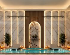 an indoor swimming pool surrounded by marble walls and potted plants on either side of it