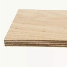 several pieces of plywood are stacked on top of each other in front of a white background