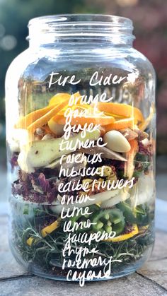 a jar filled with food sitting on top of a table