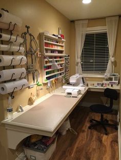 a sewing room with lots of crafting supplies