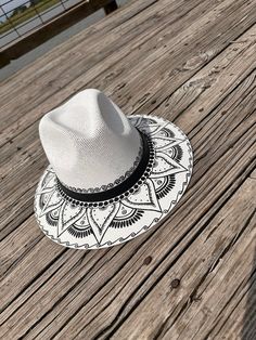 Don't miss your opportunity to own this one of a kind hand painted hat. The detailing is impressive. Perfect for a day at the beach, a sporting good outing or everyday use. Perfect for adding an extra special touch to your outfit. Size is Medium Custom White Handmade Fedora, Custom Handmade White Fedora, White Fedora Panama Hat For Festivals, White Flat Brim Straw Hat For Festivals, Whimsical Fedora Beach Hat, Whimsical Fedora Hat For Beach, Whimsical Fedora For Beach, White Brimmed Fedora For Festival, Handmade White Beach Hats