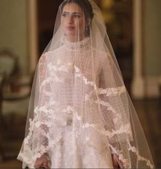 a woman in a wedding dress and veil