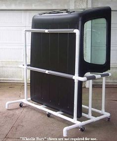 an old television sitting on top of a cart