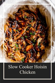 slow cooker hoisin chicken in a white bowl with text overlay that reads slow cooker hoisin chicken