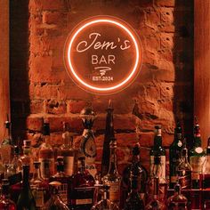 there is a bar with many bottles on the counter