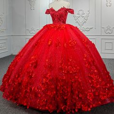 Make a bold and beautiful statement on your quinceanera with the Sweet Valentine Red Quinceanera Dress. The dress features a stunning ball gown silhouette crafted from layers of delicate tulle fabric that provide volume and movement, giving you a dreamy and ethereal look. The striking red color symbolizes love and celebration, making it the perfect choice for your special day. The off-the-shoulder neckline is the epitome of romance, beautifully framing the shoulders and collarbones, while the sl Red Quinceanera Dress, Tulle Balls, Bridal Gowns Mermaid, Tulle Flowers, Lace Prom Dress, Quinceanera Dress, Tulle Ball Gown, Fantasy Gowns, Sweet Valentine