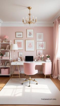 a pink desk and chair in a small room with pictures on the wall above it