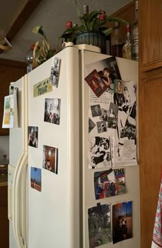 a white refrigerator covered in pictures and magnets