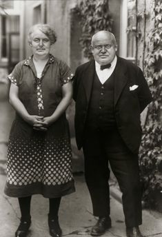 an old black and white photo of two people