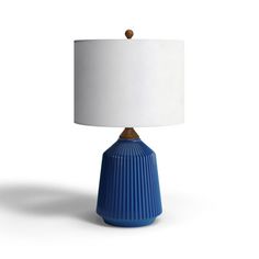 a blue table lamp with a white shade