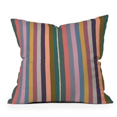 a multicolored striped pillow on a white background