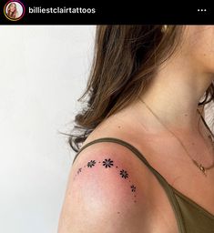 a woman with a tattoo on her shoulder