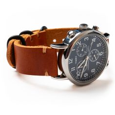 A comfortable leather band that is even more beautiful than the timepiece it's connected to.Our full-grain leather means your watch strap will develop character and patina. We hand-sew this strap with a thick Tiger Thread so it will never unravel or come apart. You can choose between sleek matte black or stylish polished nickel hardware. A removable sliding keeper keeps your strap firmly in place. We take a lot of pride in our work and back each strap with a lifetime guarantee.Fit and Sizing:Wit Polished Nickel Hardware, Leather Watch Band, Leather Stand, Nickel Metal, Watch Lover, Black Polish, Nickel Hardware, Leather Watch Strap, Polish Silver