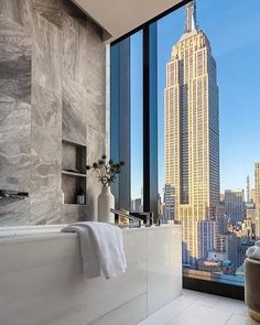 a bathroom with a view of the empire building