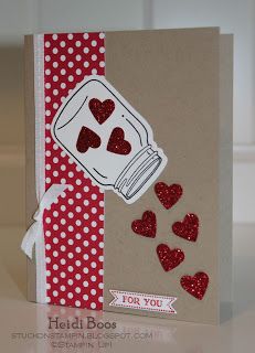 a handmade card with hearts in a jar