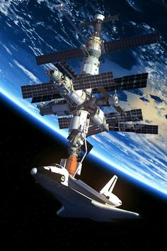 an artist's rendering of the space station in orbit, with earth in the background