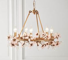 a chandelier hanging from the ceiling in a room