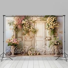 an old door with flowers on it is in front of a backdrop